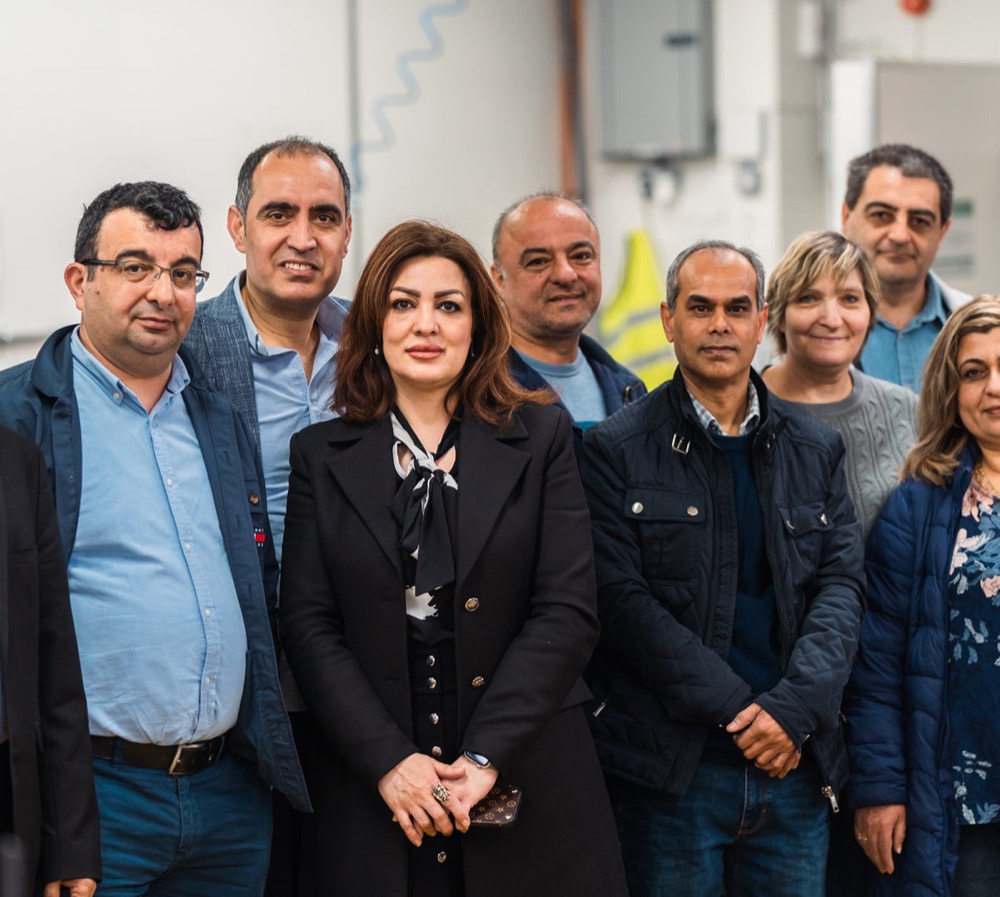 The team at Blackhorse Lane Ateliers gathered together on the factory floor
